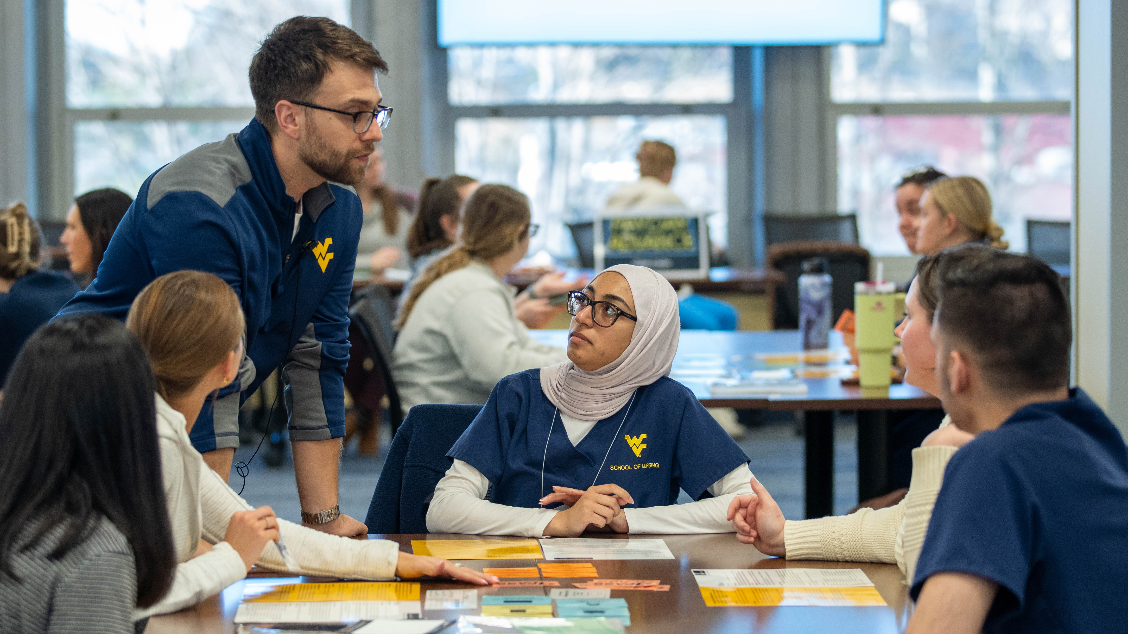 students at a table participating in an interprofesstional education opportunity