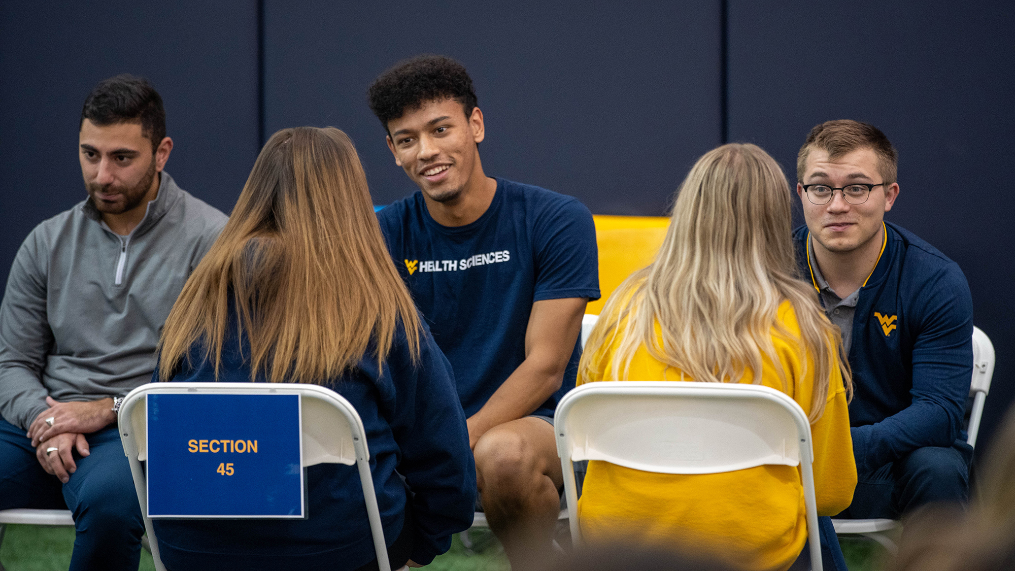 students sitting across from each other talking